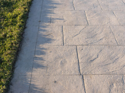 stamped concrete experts This is an image of a decorative stamped concrete walkway.